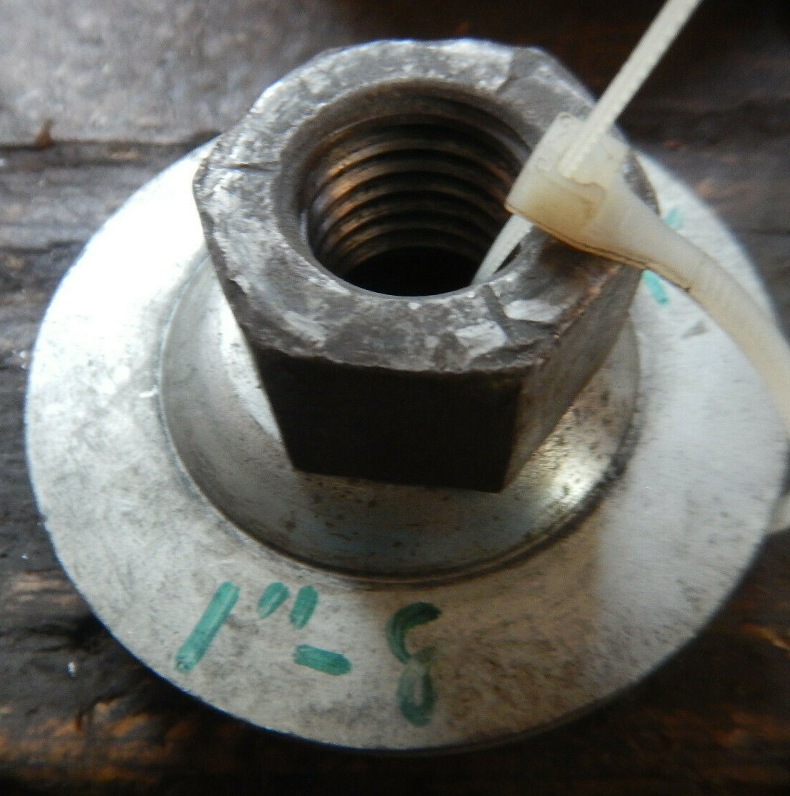 LARGE BENCH GRINDER RIGHT SIDE ARBOR NUT AND FLANGES 1