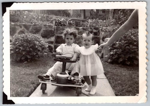 Vtg B&W Snapshot Two Children Boy On Toy Pedal Car Girl In Dress Garden 1950s