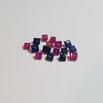 Princess cut natural red rubies and blue sapphires. 