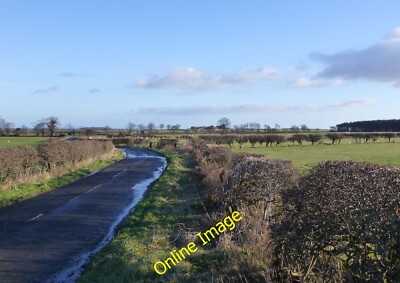 Photo 6x4 Road to Henhill Warenford Flat wet grassland after much rain. c2014