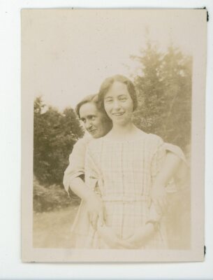Woman graceful pose  hands on arms vintage snapshot found black and white  photo