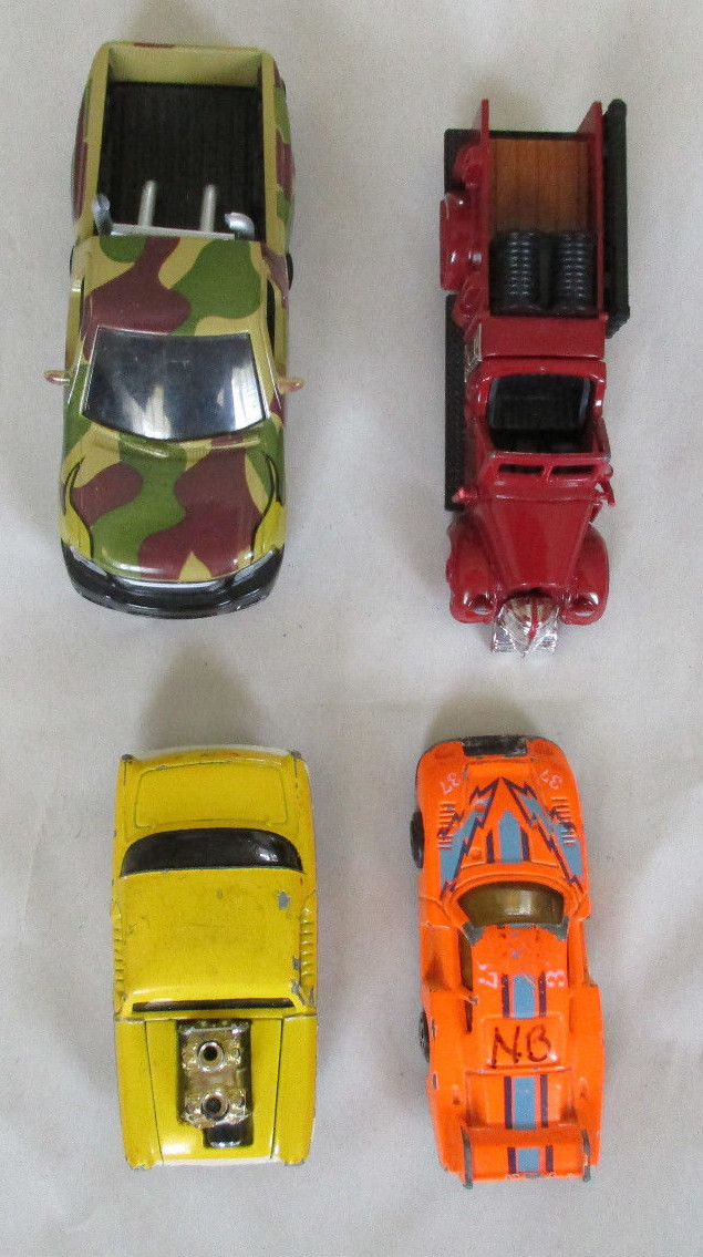 Lot of 59 of Toy Cars, Trucks, a Helicopter, a Plane, a Tank and a Tractor.
