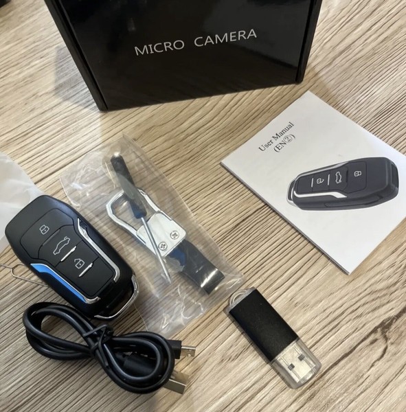 Micro camera kit with USB cable and car key fob.