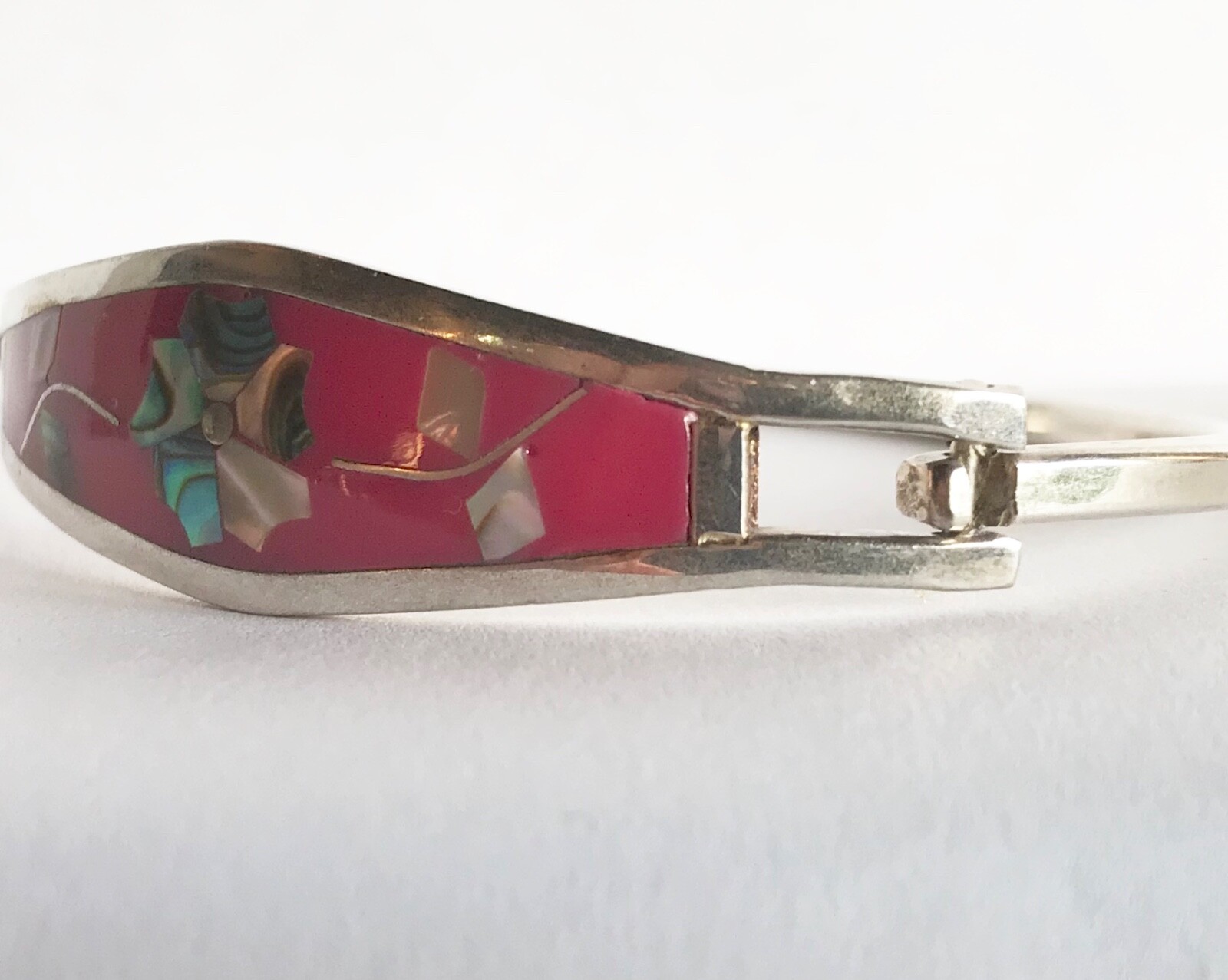 Vintage Mexican Silver Floral Abalone Inlay Bracelet with Fucia Red background