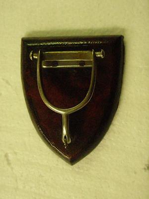 Antique Paper Holder In The Design Of a Spur Mounted On a Leather Covered Plaque