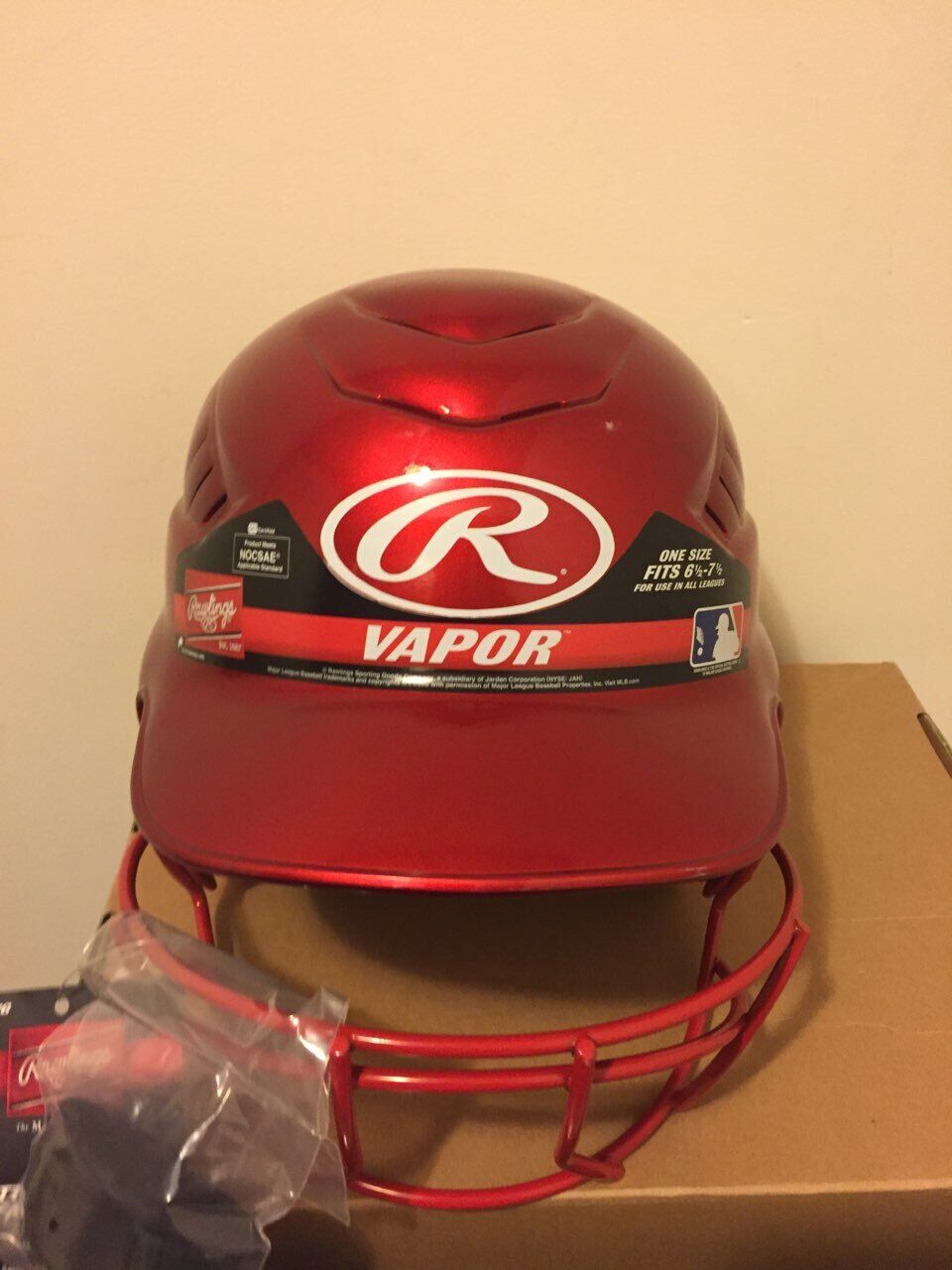 Red single flap batting helmet