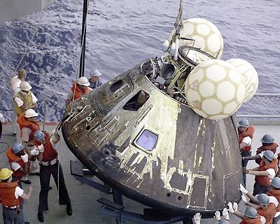 Apollo 13 Command Module Odyssey hoisted onto deck of USS Iwo Jima Photo Print