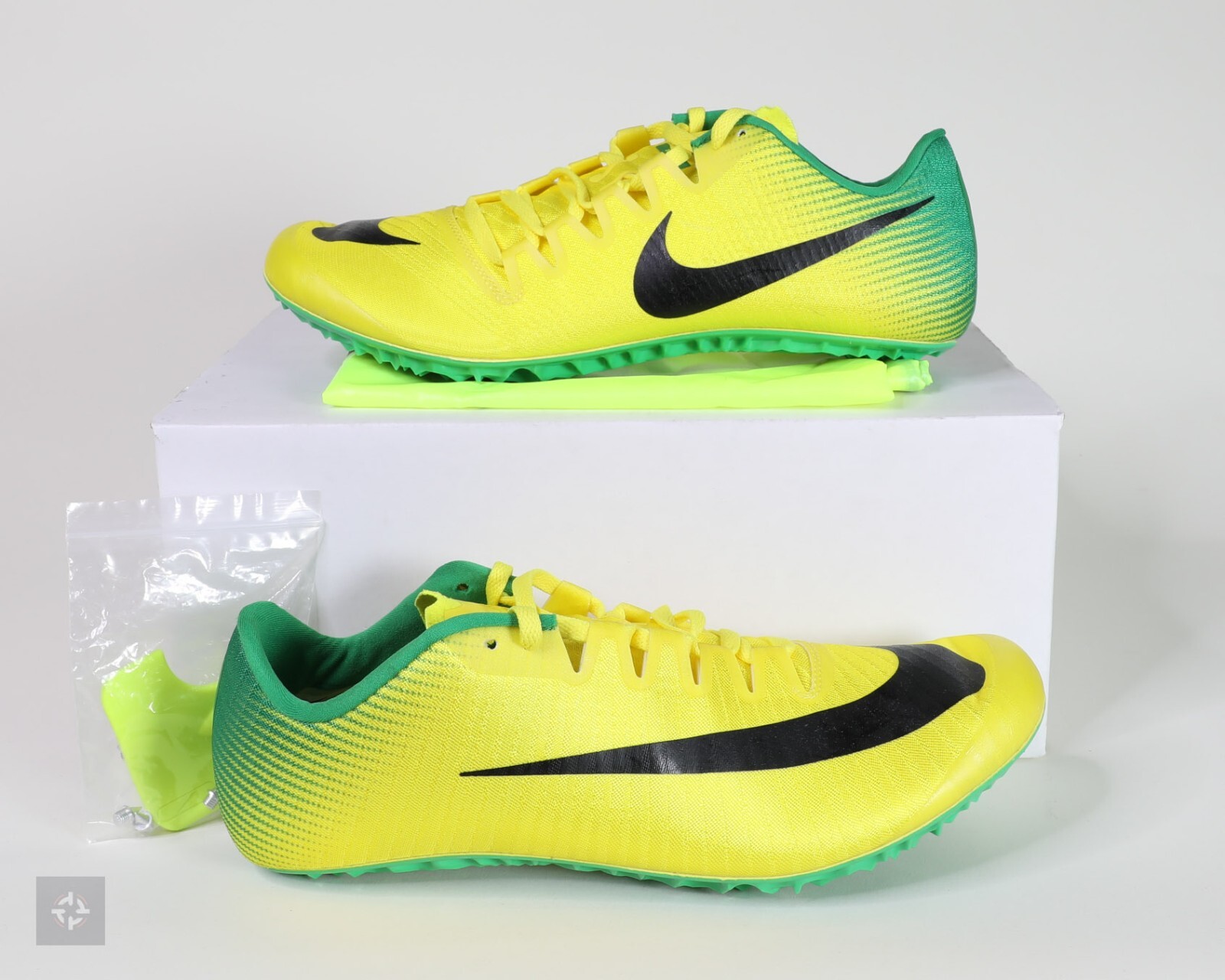 yellow nike spikes