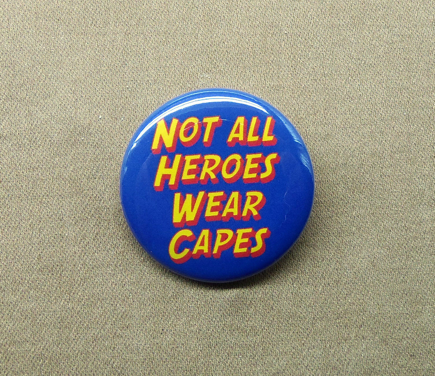 Not All Heroes Wear Capes 1.25” Button Superhero Pin Not All Heroes Wear Capes 1.25” Button Superhero Pin