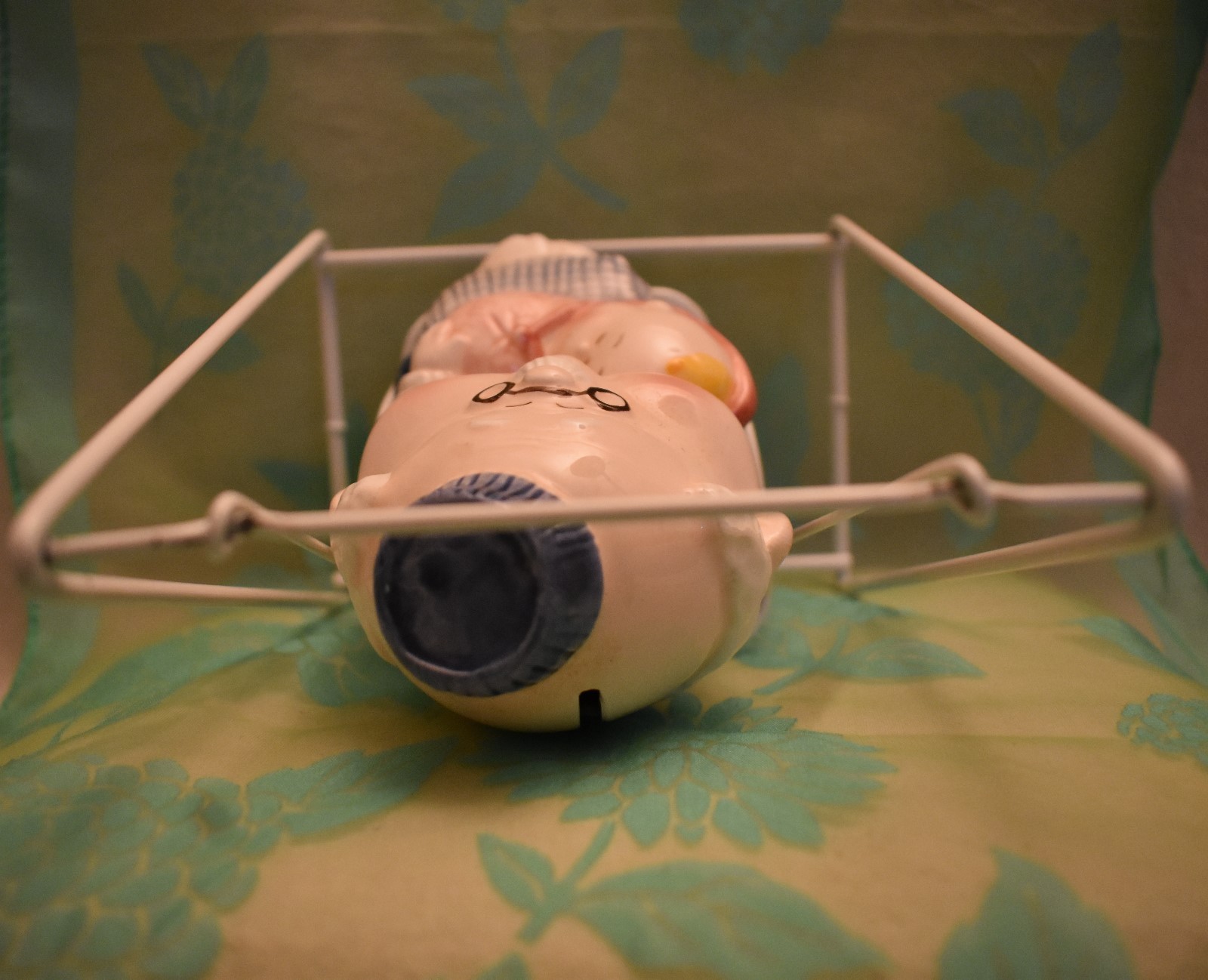 Grandpa and Baby Ceramic Bank on Metal Swing Has stopper 6 3/8 inches tall