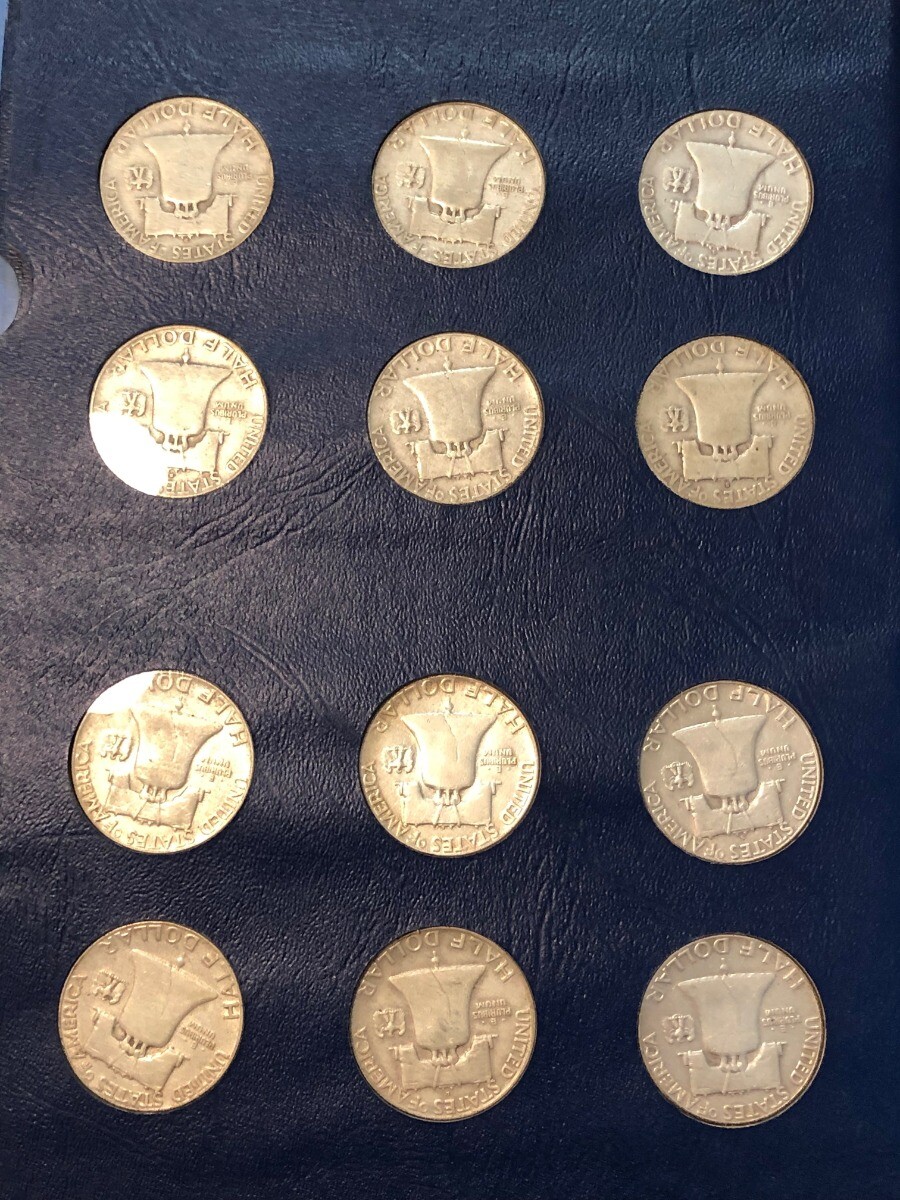 COMPLETE SET of 35 Franklin silver half dollars in bookshelf album. 1948-1963D.