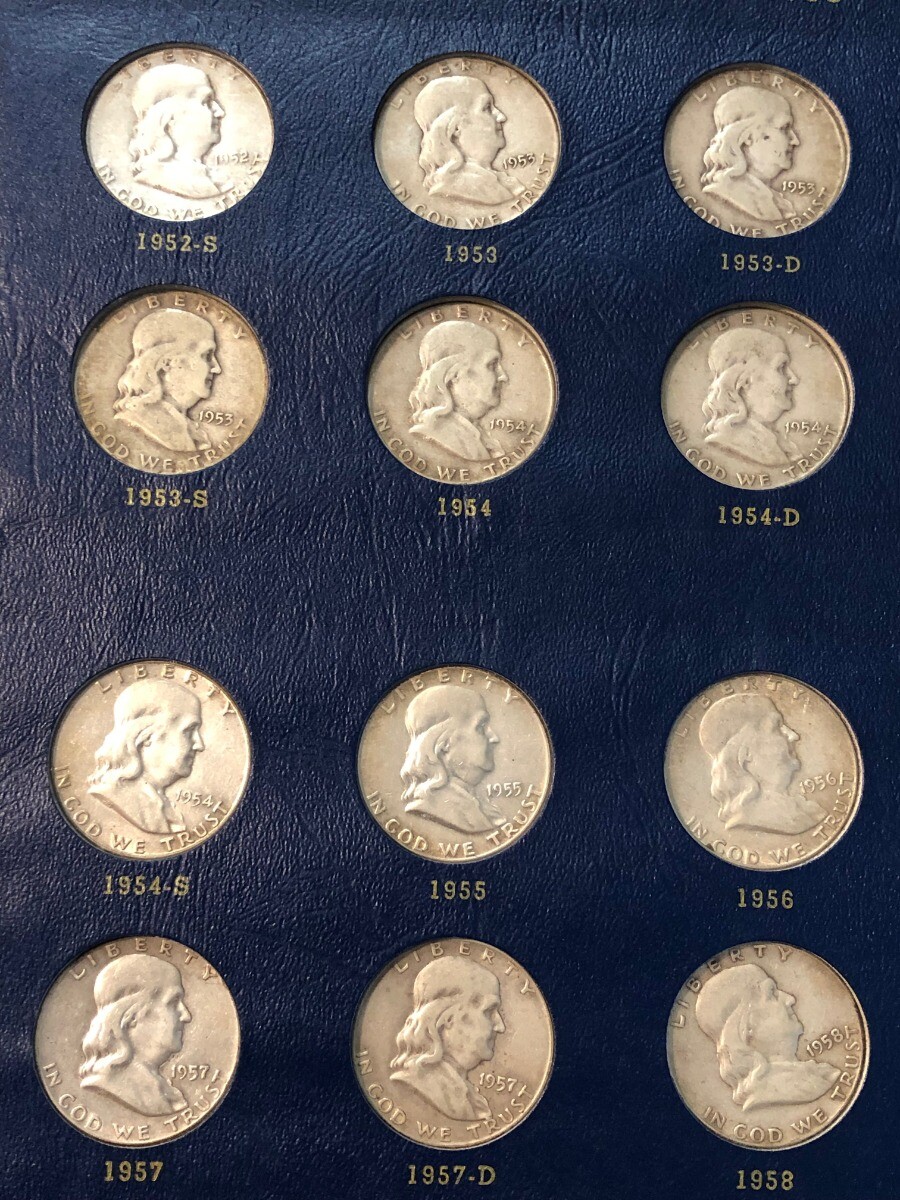 COMPLETE SET of 35 Franklin silver half dollars in bookshelf album. 1948-1963D.