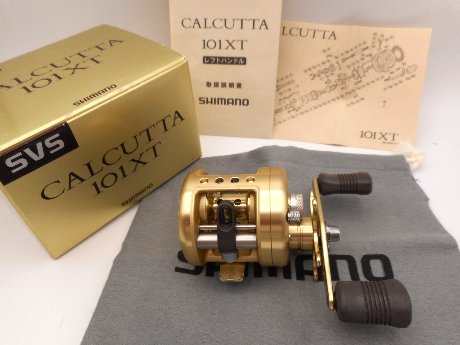 ① Shimano CALCUTTA 101xt Shimano Calcutta 101XT Left Handle Baitcasting Reel w/box