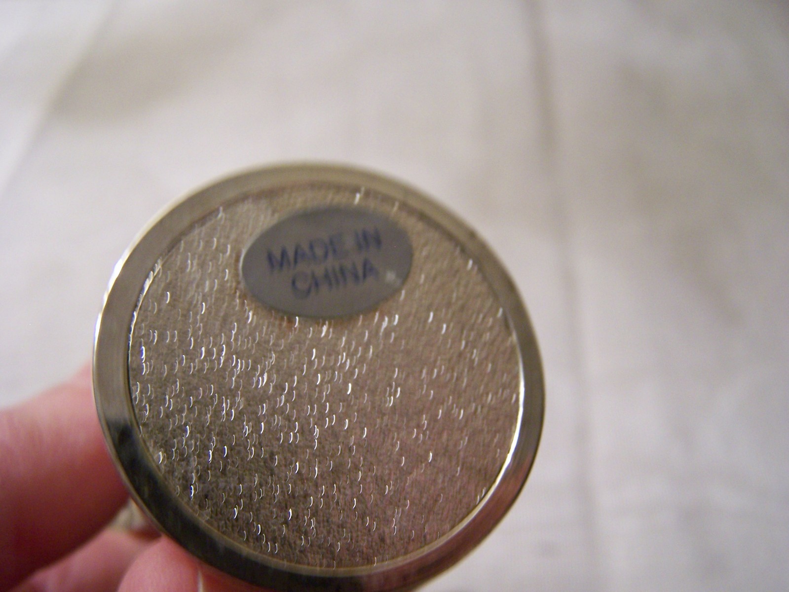 Towle's silversmiths wine coaster and tabletop cross