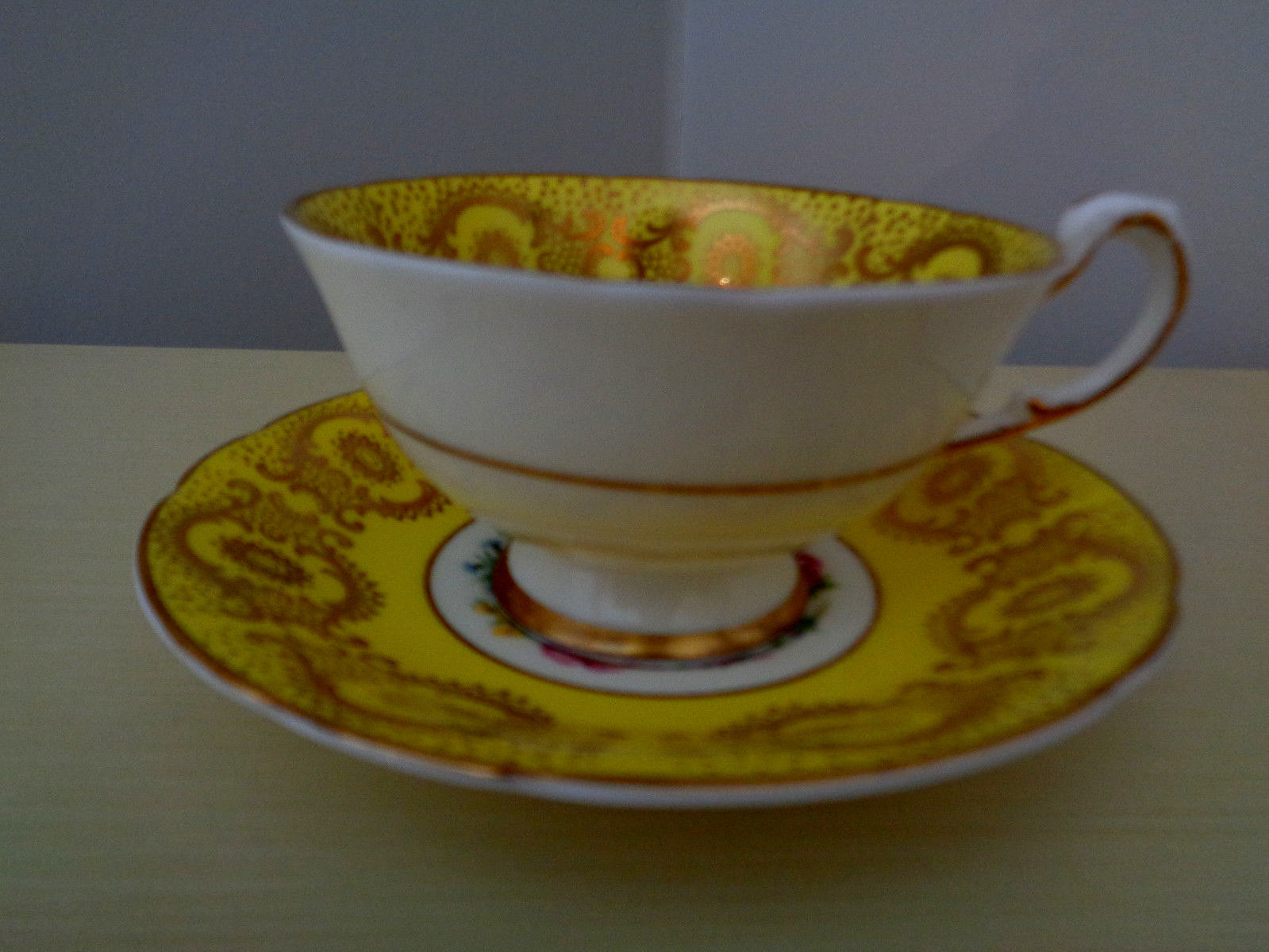 PARAGON STUNNING YELLOW TEA CUP AND SAUCER