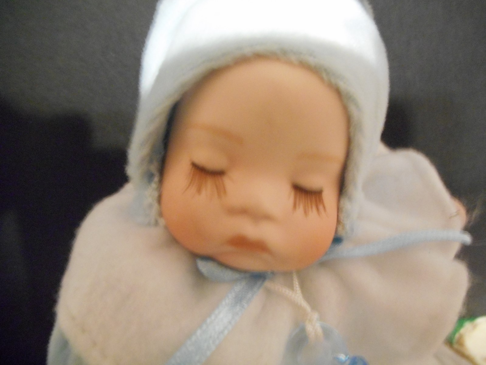 Lon-E Porcelain Baby Sleeping In Baby Shoe Plays 