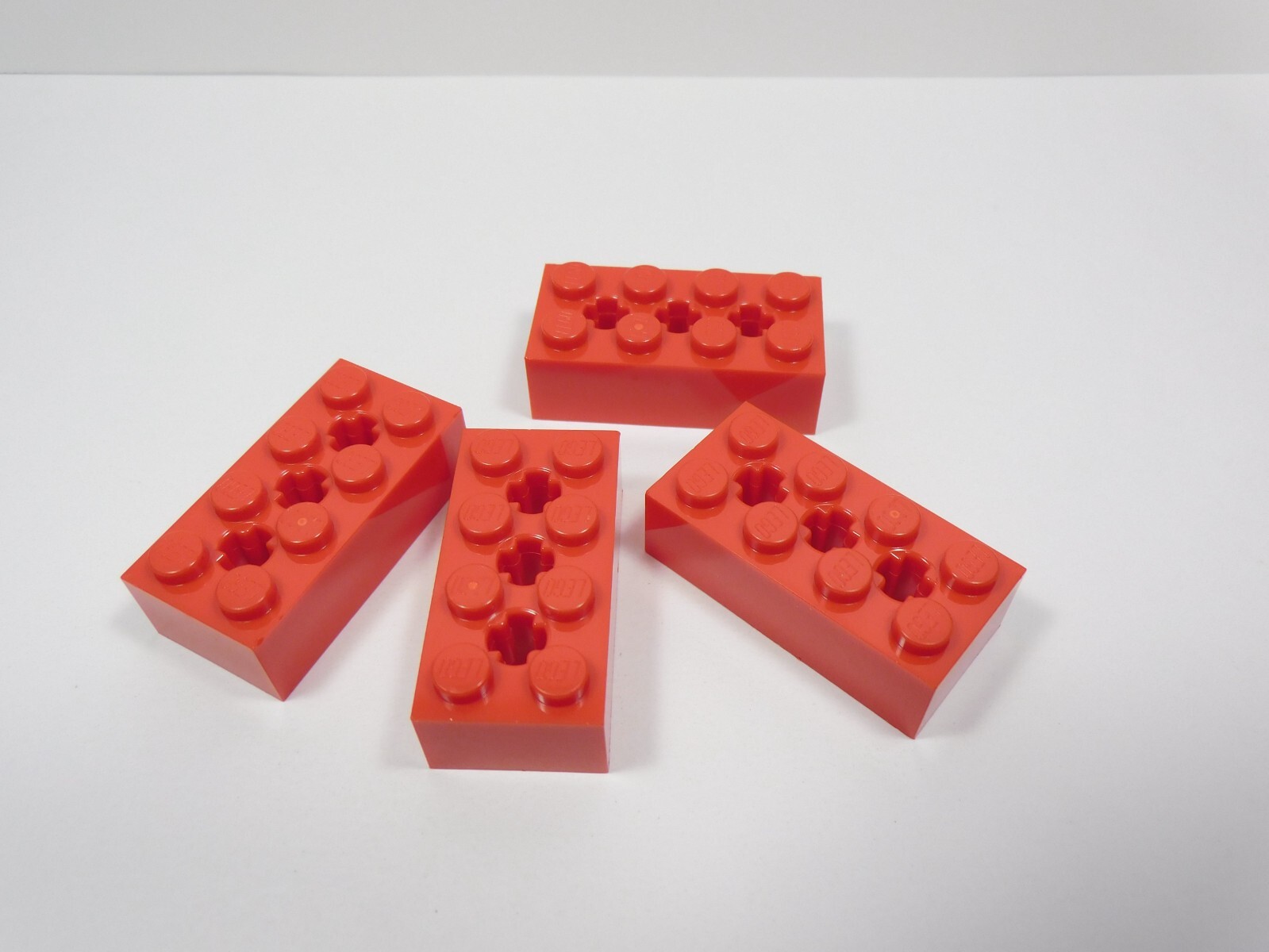 LEGO Lot of 4 Red 2x4 Modified Bricks w/ Axle Holes Part No