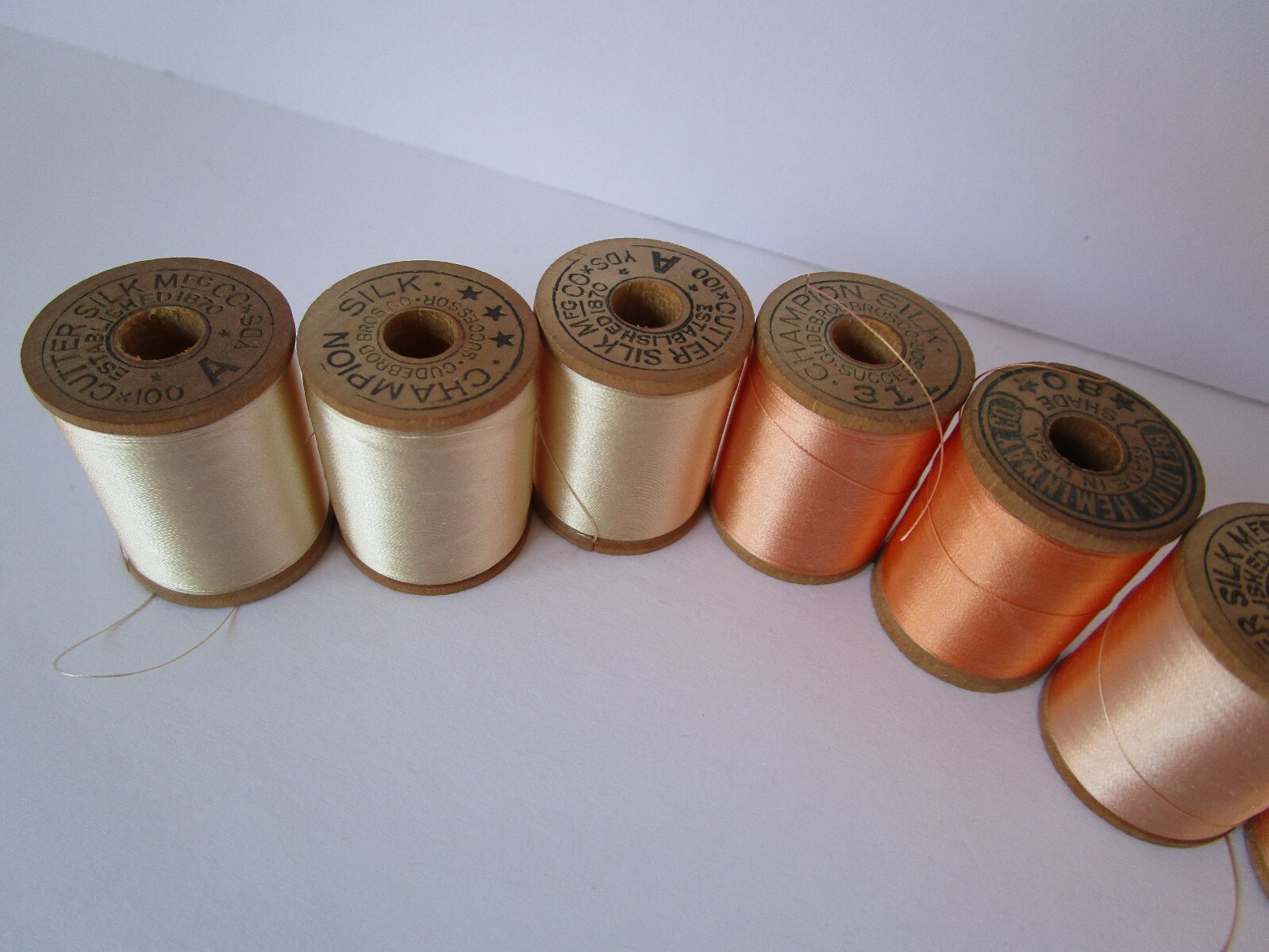 8 Vintage Silk Thread spools pastels peach cream