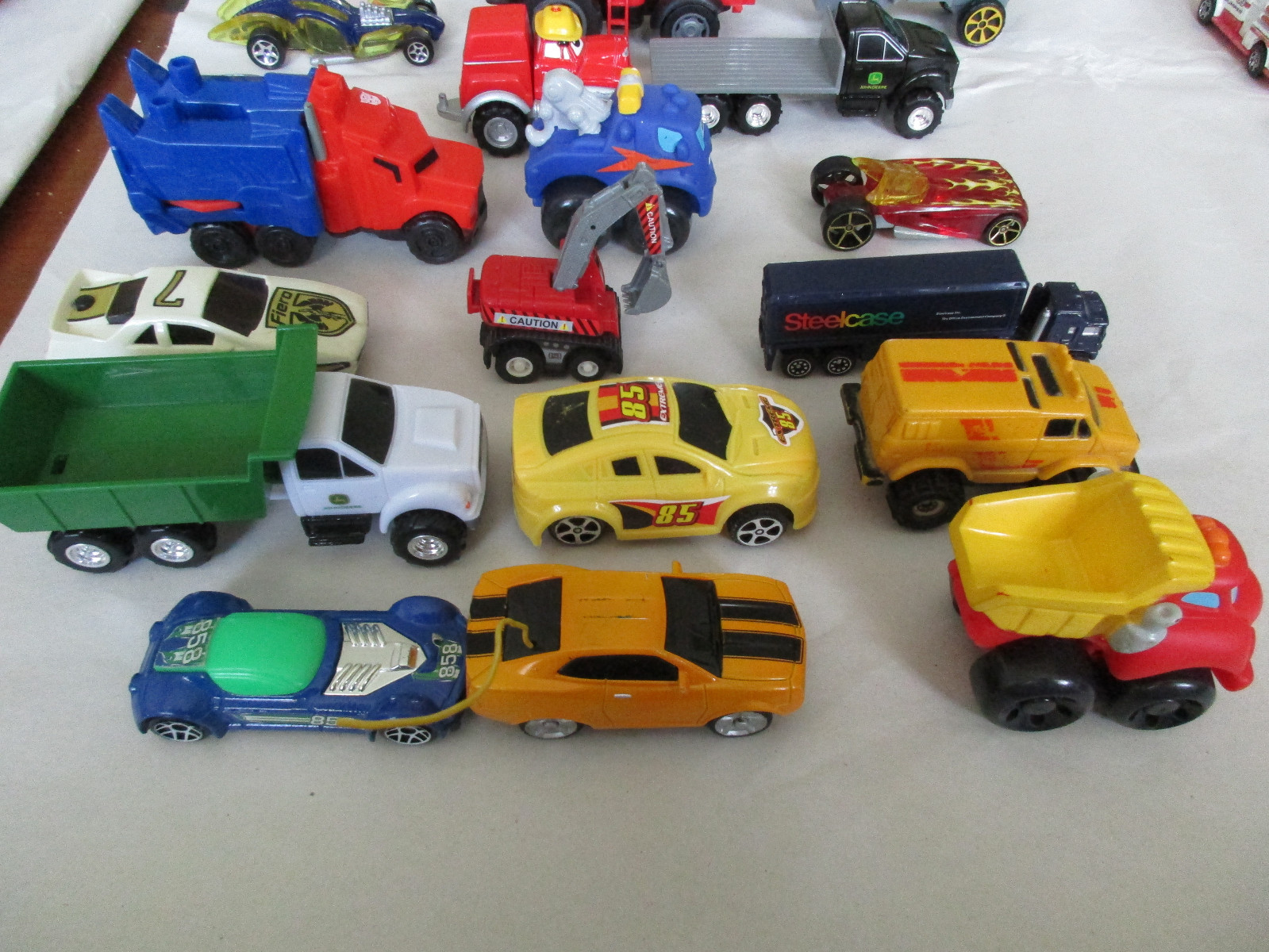 Lot of 59 of Toy Cars, Trucks, a Helicopter, a Plane, a Tank and a Tractor.