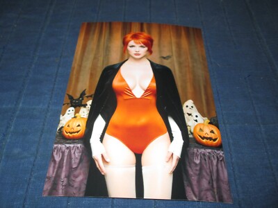 PRETTY REDHEAD MODEL POSING IN BLACK ROBE-ORANGE LINGERIE-WHITE STOCKINGS PHOTO