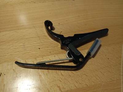 Kyser quick change capo for six string acoustic guitars