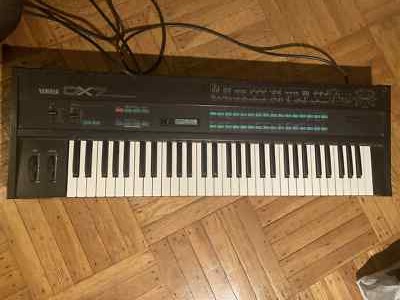 Yamaha DX7 Synthesizer, good condition, with case, 3 cartridges, music stand