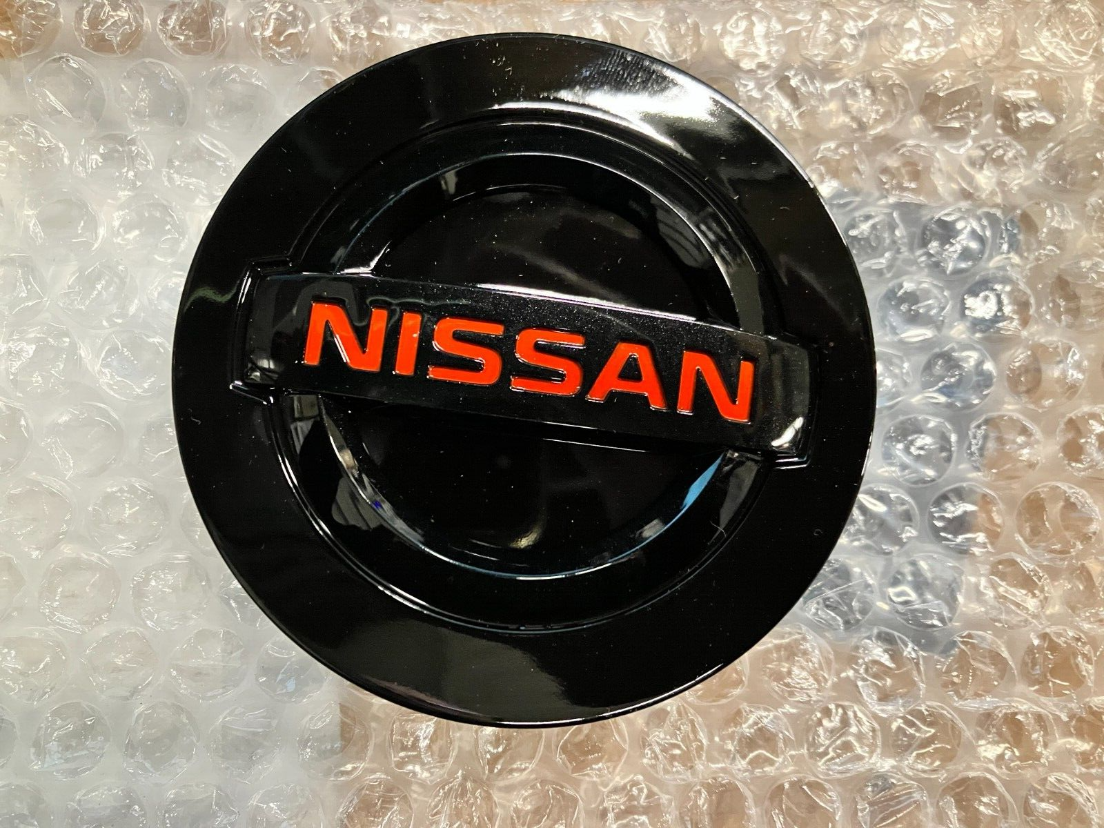 Nissan Center Cap New Style Black Gloss Red Lettering