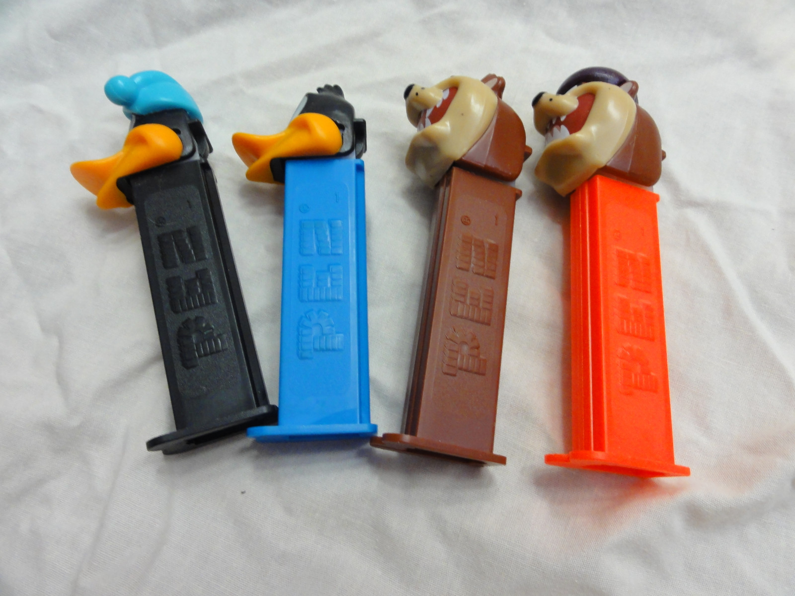 Pez Lot 4 LOONEY TUNES Daffy Duck Issue B/Sleepy ~ Tasmanian Devil A/Cycling Taz