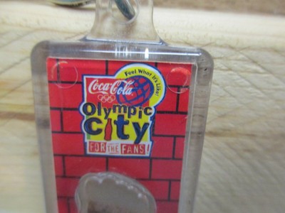 DA7339 Coca-Cola 1996 Olympic City Keychain with Clay from the Olympic Grounds