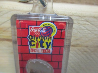 DA7339 Coca-Cola 1996 Olympic City Keychain with Clay from the Olympic Grounds