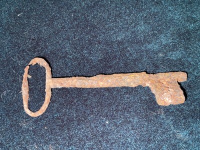 ancient door key, heavily rusted as it was dug from the ground in Leicestershire