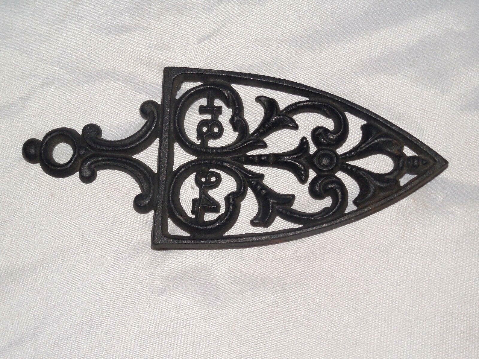 TWO PRE-OWNED BLACK CAST IRON  KITCHEN TRIVETS