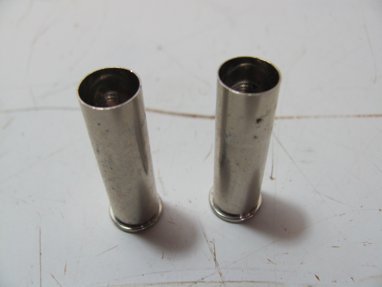 VINTAGE PAIR OF SHELL CASING VALVE CAPS