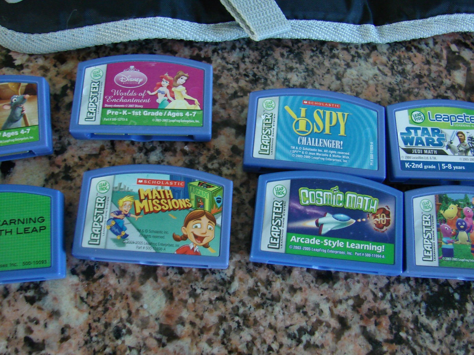 LOT OF 14 LEAPSTER,LEAP FROG CARTRIDGES AND THE LEAPSTER CARRIER  IN GREAT SHAPE