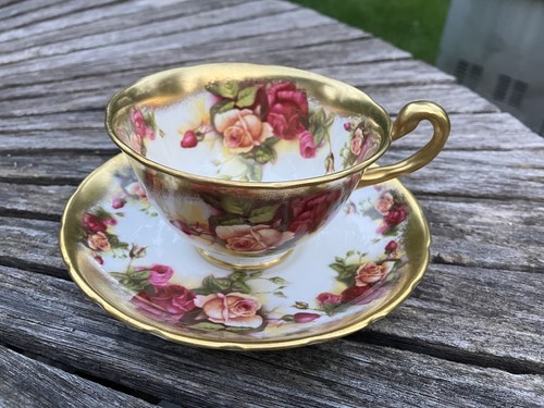 Royal Chelsea Golden Rose Tea Cup And Saucer Set. Defect on
