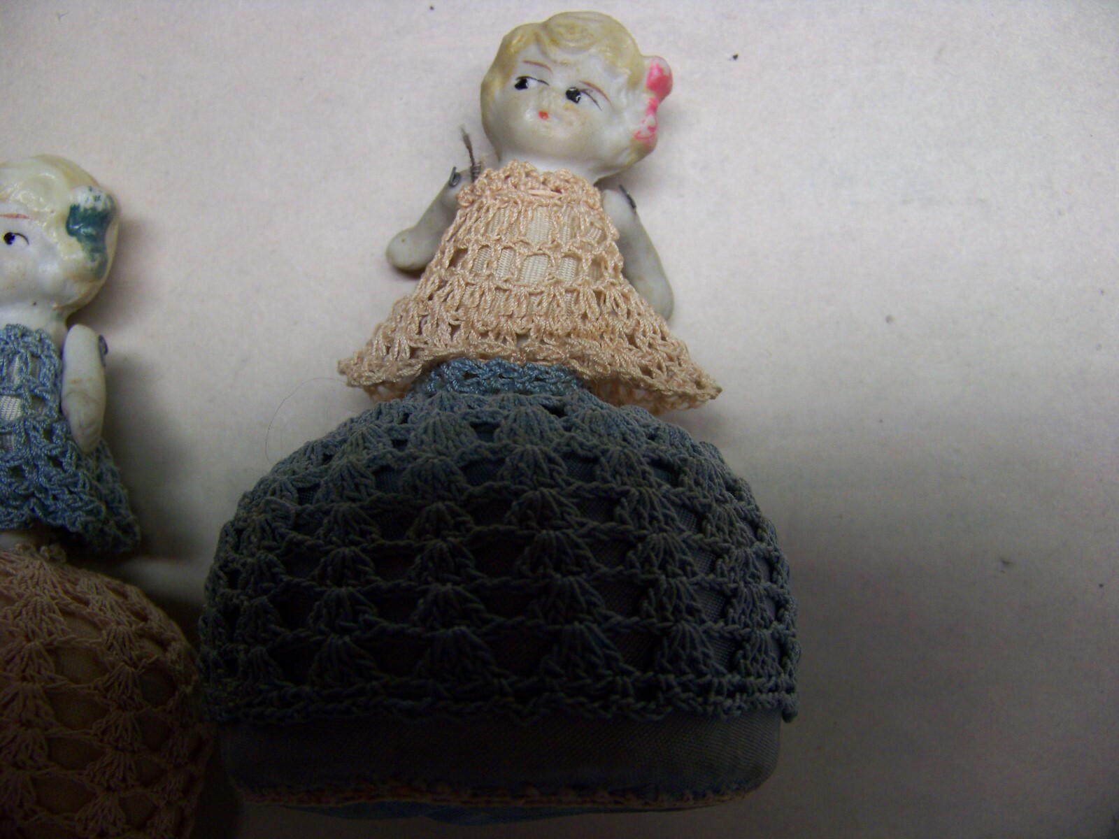 Pair of vintage doll pin cushions