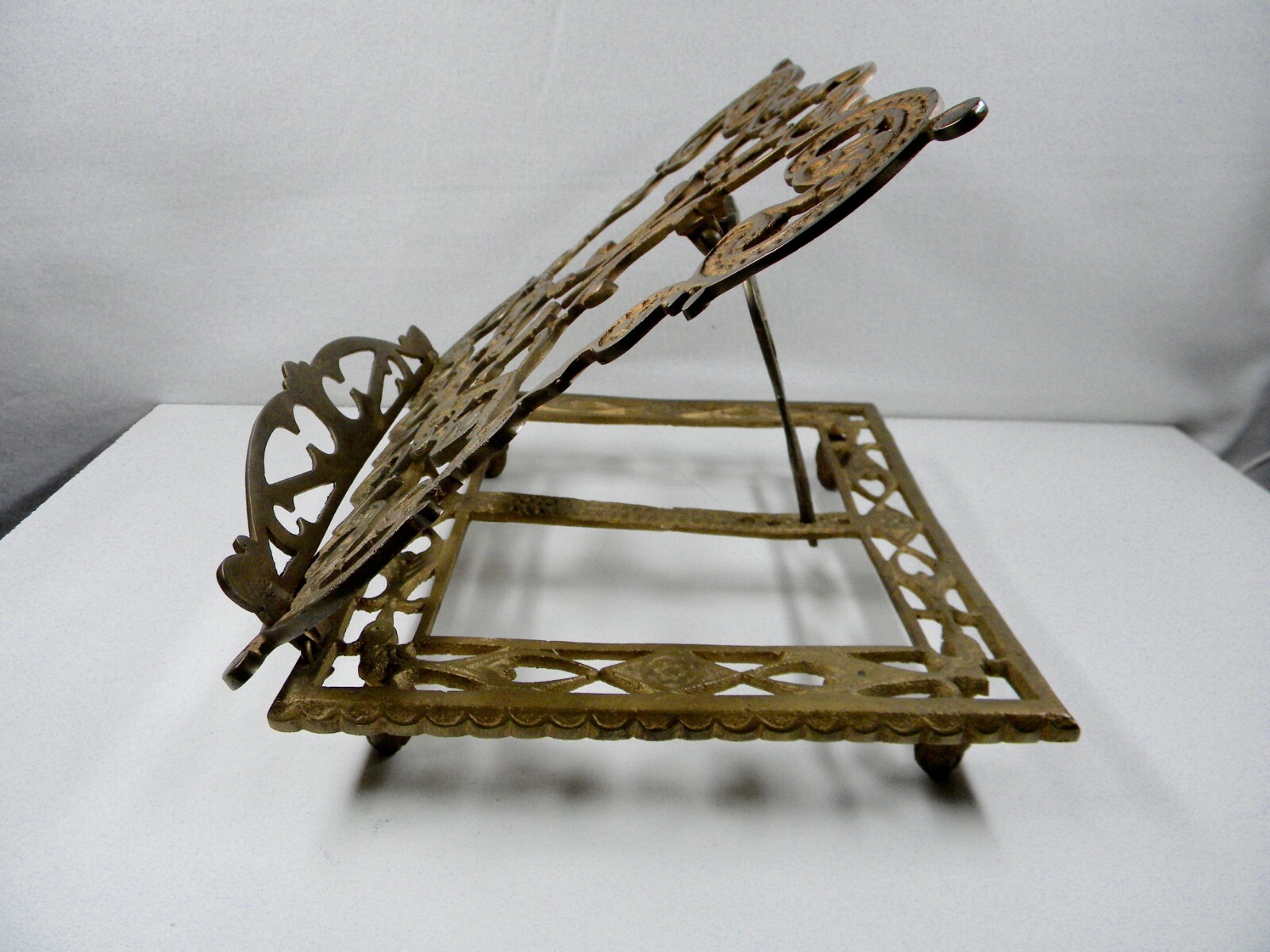 Cast brass book stand.
