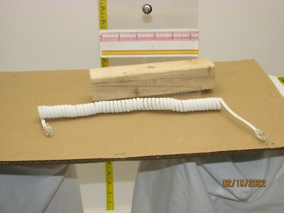 The listing is for:Flat White Coiled Telephone Cord - Short Length - 4 Inch Lead