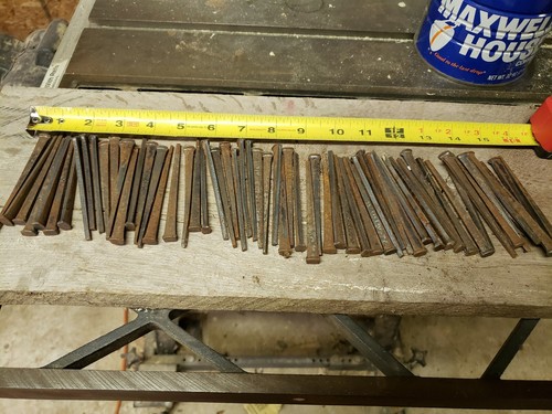 63 Antique 3 1/2 inch, square cut nails hand made unused, straight but rusty.