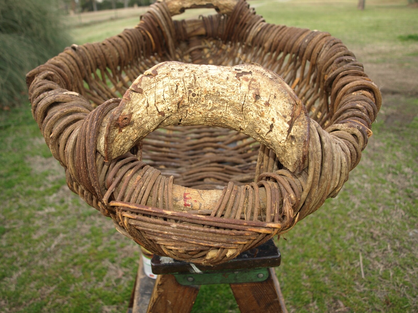 primitive gathering stick basket signed E.