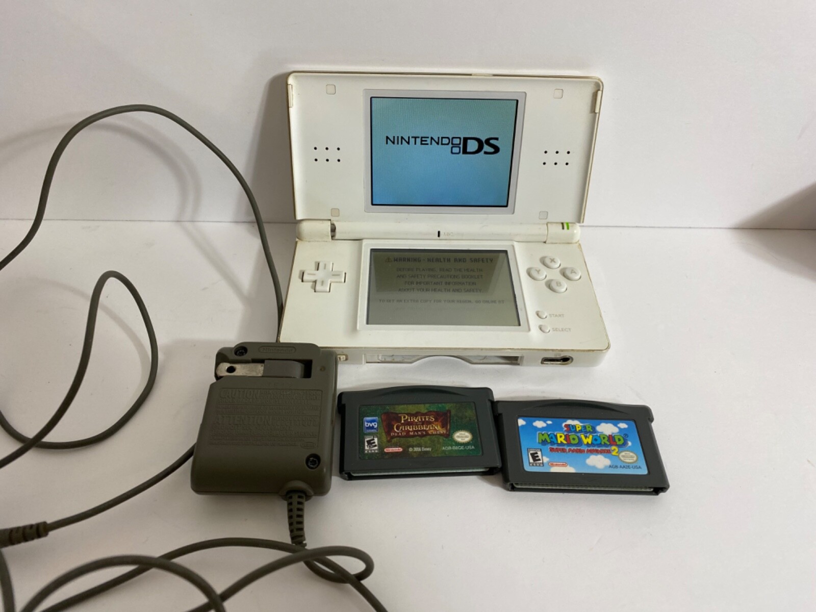Nintendo DS Lite.White . Used. works but broken where it Nintendo DS Lite.White . Used. works but broken where it