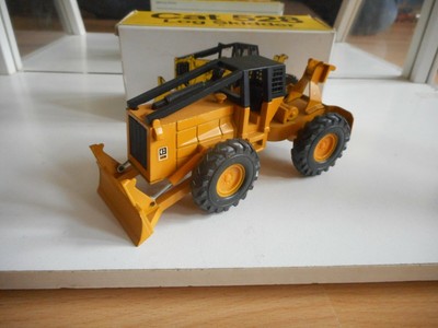 NZG Caterpillar Cat 528 Log Skidder in Yellow on 1:50 in Box