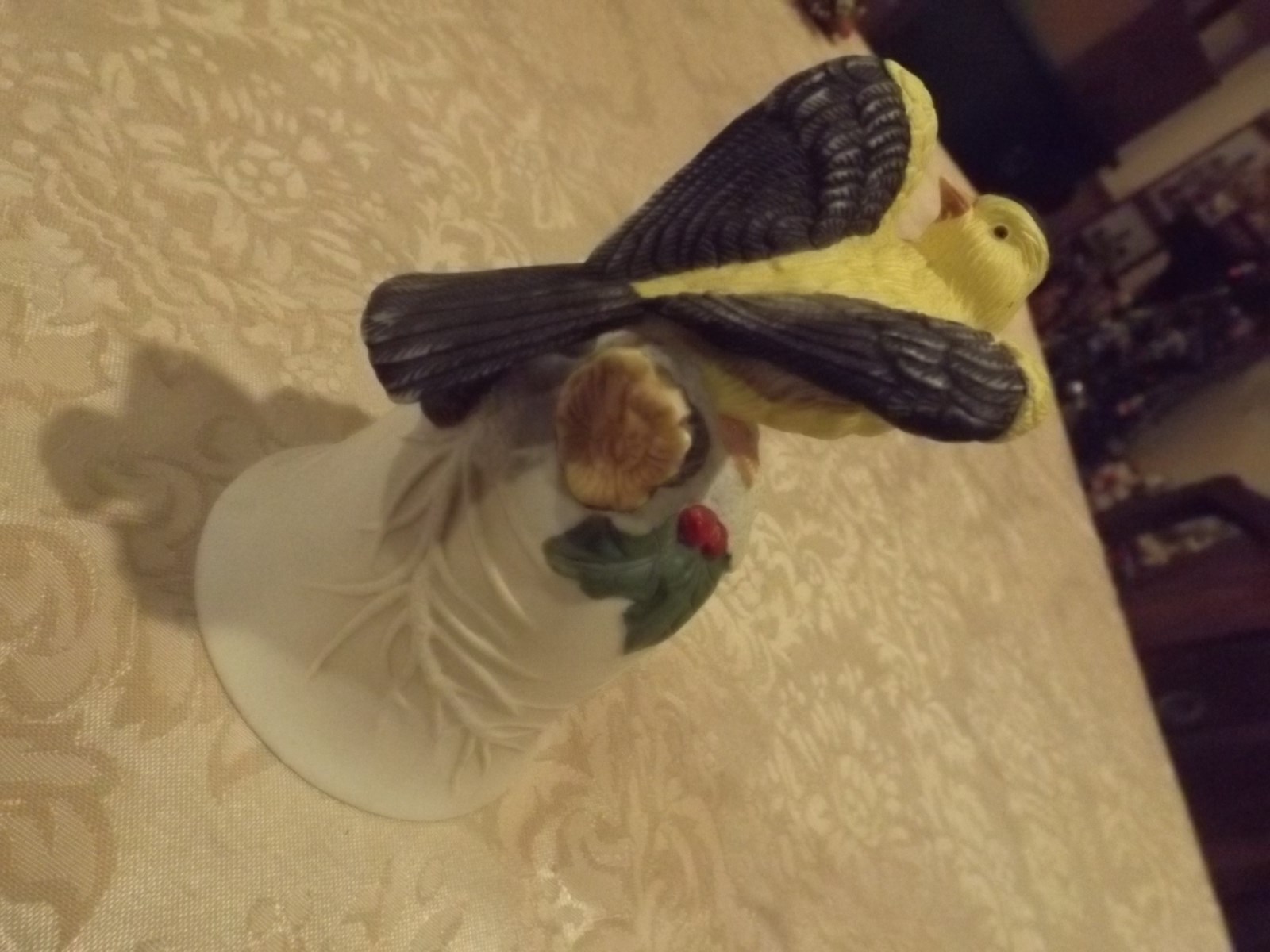 Decorative Bisque Porcelin Oriole with holly Bell