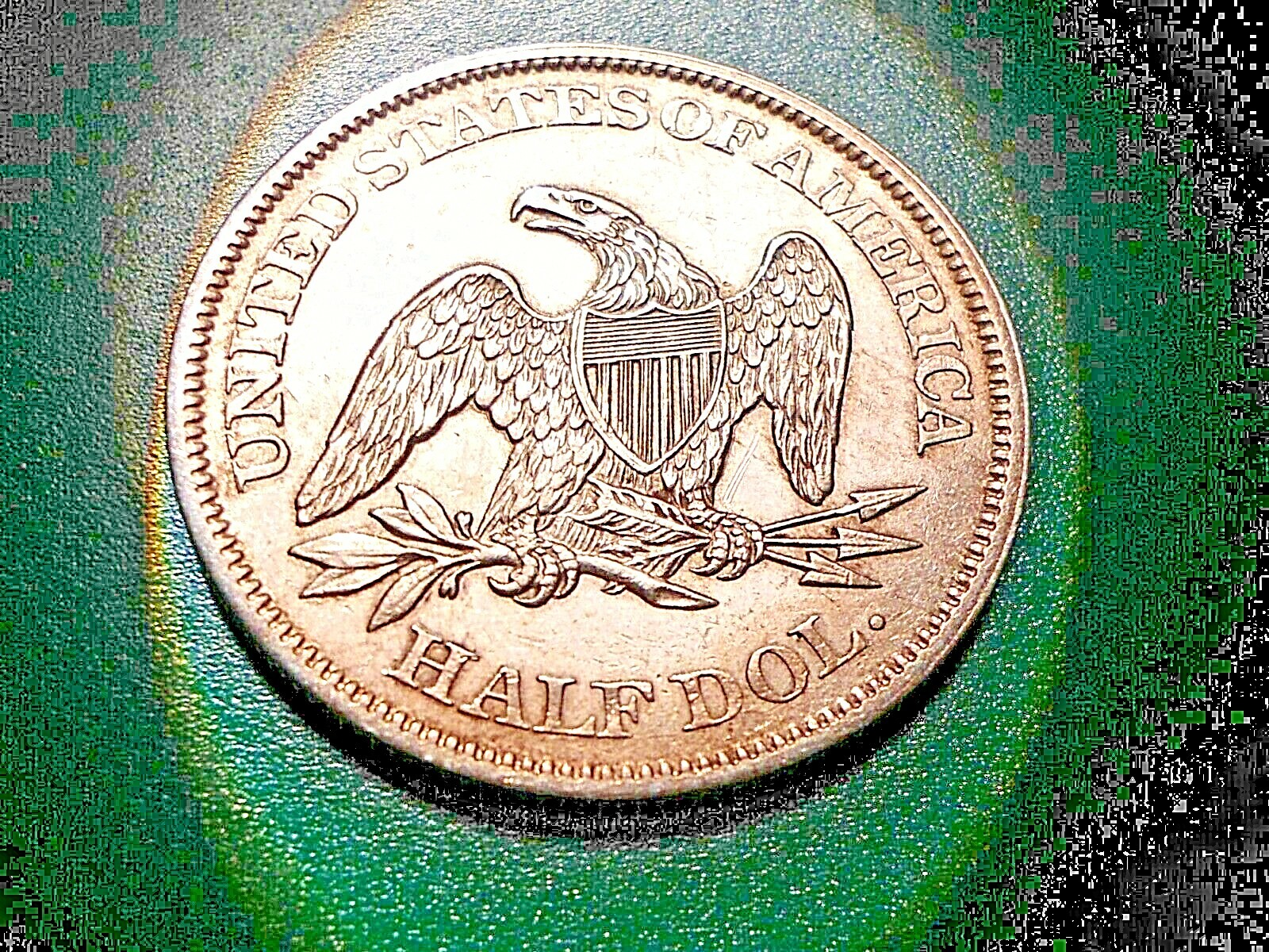 1861 P Seated Liberty Half Dollar. Little wear on talons/feathers/high spots.