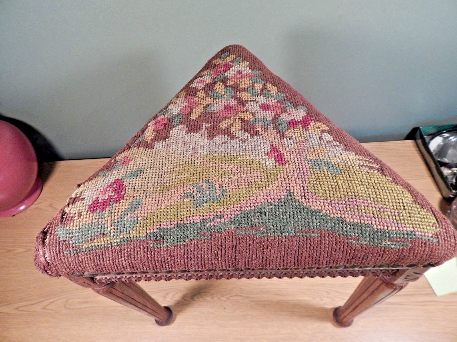 ANTIQUE FRENCH UNUSUAL TRIANGULAR CARVED FOOTSTOOL WITH OLD NEEDLEPOINT COVER