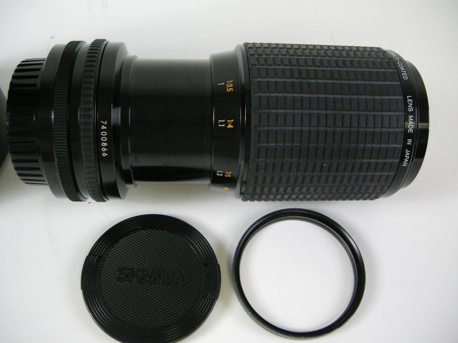 Sigma 70-210mm f4.5 Zoom K II MC Konica Mt. lens with caps, filter and case.