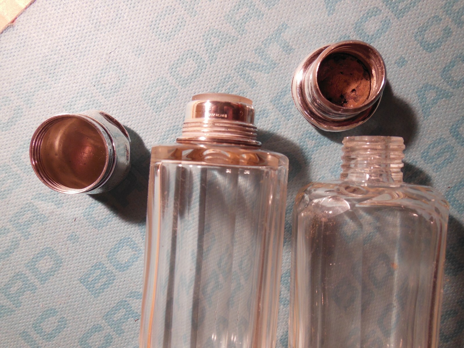 Two sterling silver & cut glass cologne bottles, English hallmarks