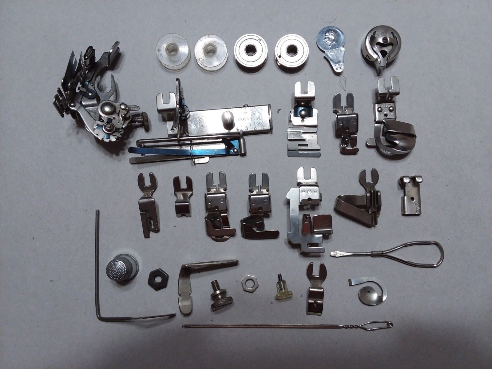 Vintage Greist attachments & parts for White sewing machine, plus metal case