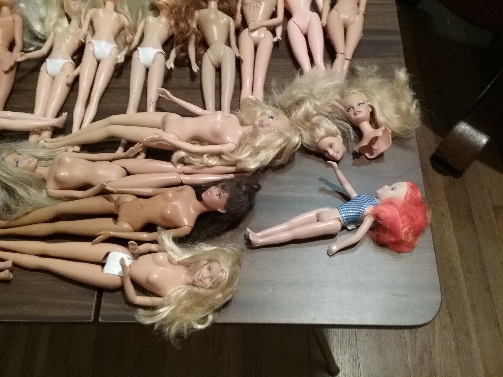 Lot of 25 fashion model dolls some BARBIE  damaged need repair or for parts