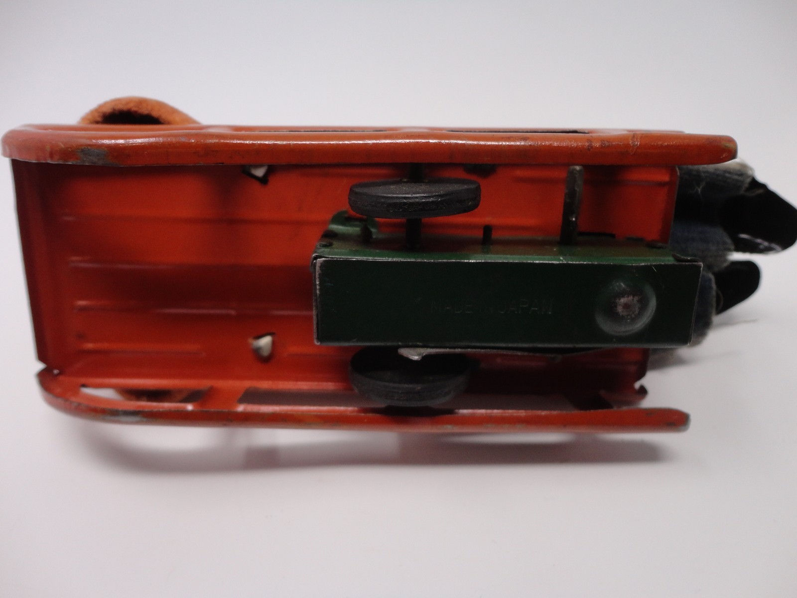 Vintage 1930's Japan Wind Up Mechanical Toy Boy on a Sled 6.75